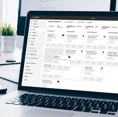 A laptop with the Karbon app on its screen.