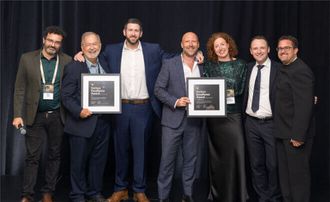 Karbon co-founder Ian Vacin and Karbon Chief Technology Officer Shai Haim presenting the 2025 Karbon Excellence Awards for AI Innovation